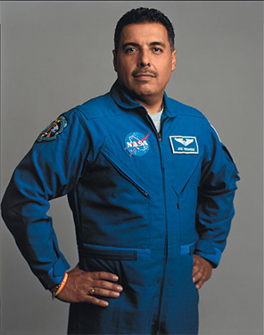 Latino man in a NASA space uniform